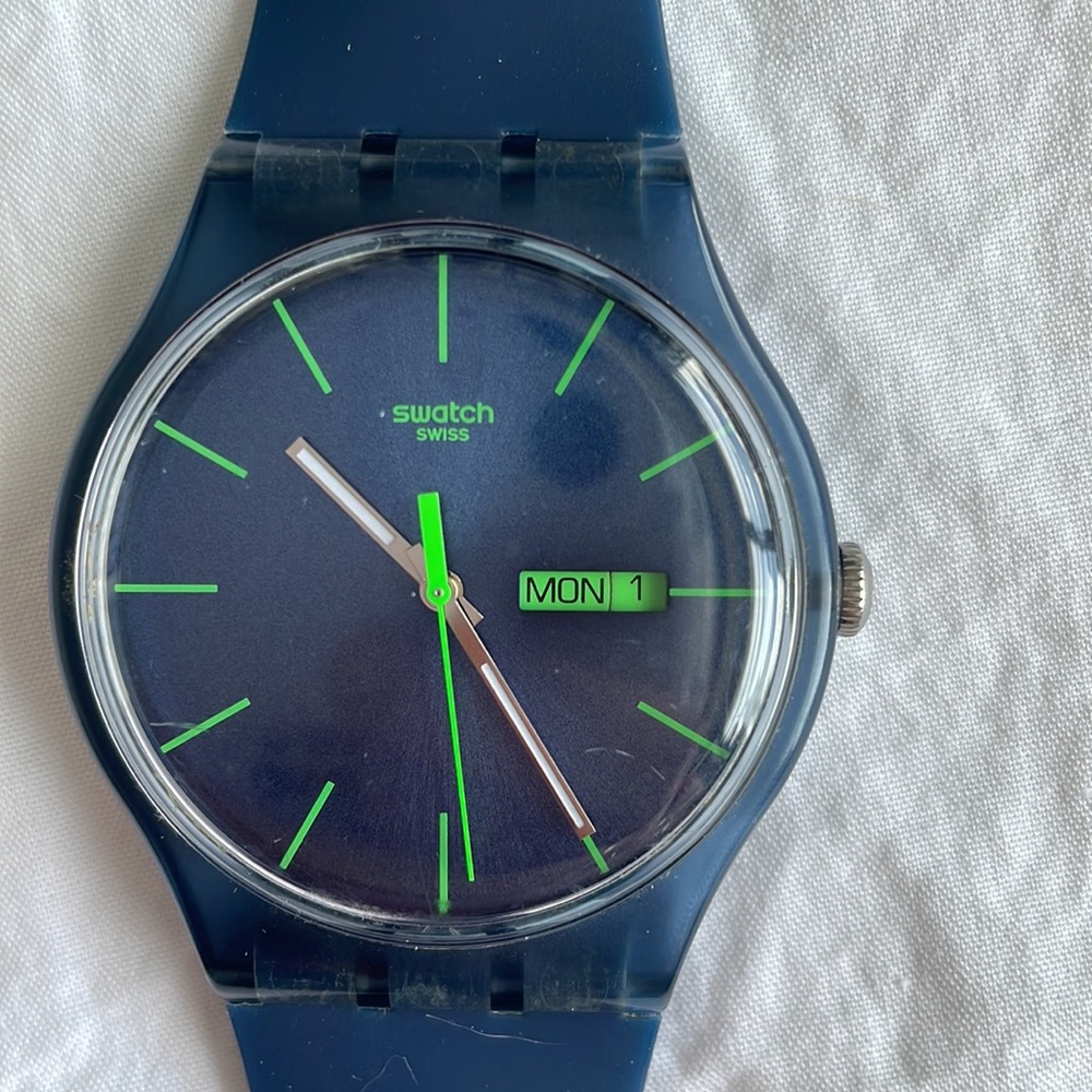 Swatch watch. Blue with green hands.
